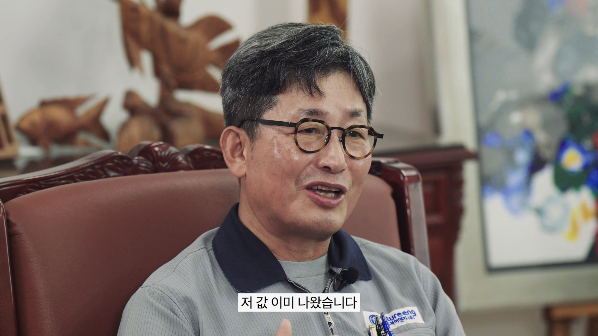 A man seating in front of camera